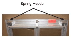 Spring hoods on a PlexiDor dog door