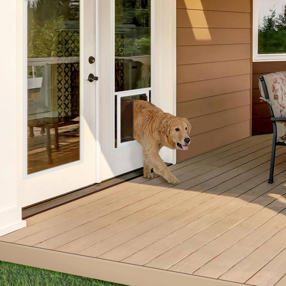 One of the benefits of a dog door in a French Door is not losing line of sight to the backyard
